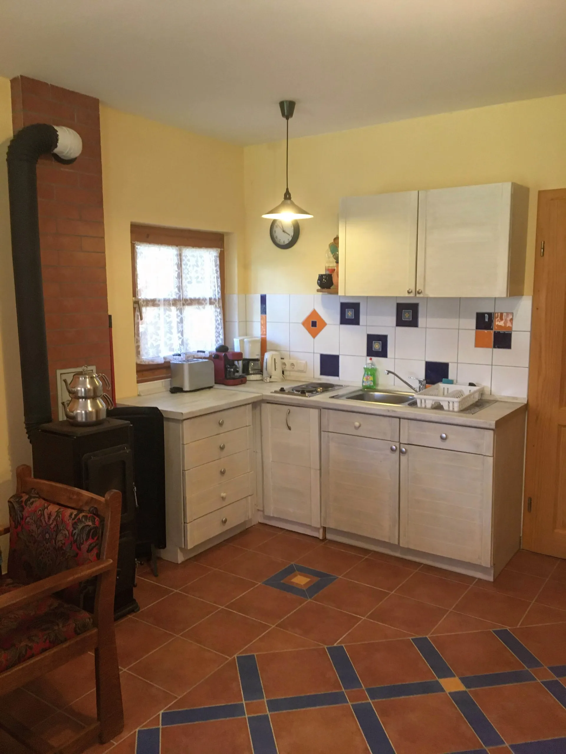 Fully equipped kitchen with wood stove